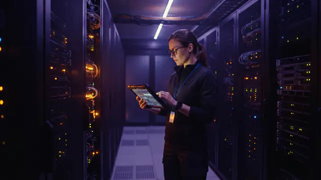An illuminated modern data center facility housing advanced GPU compute clusters.